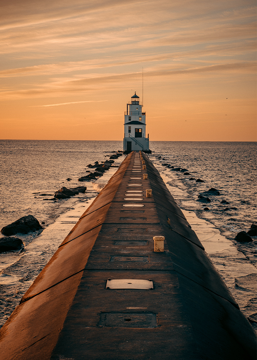🔥LAST DAY 80% OFF-A lighthouse on a pier at sunset